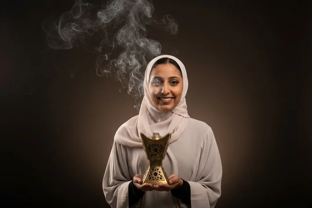 Arab Woman Holding Traditional Incense Burner with Smoke