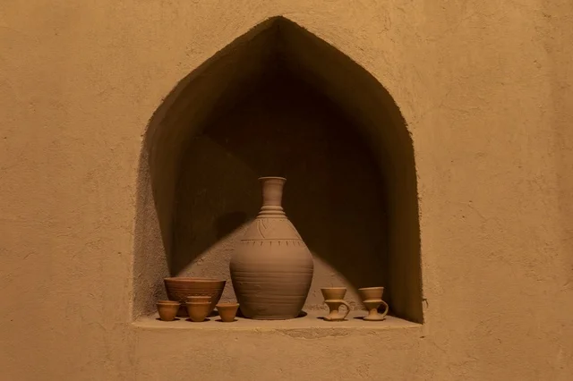 Traditional Clay Pottery in Omani Mud Wall Niche