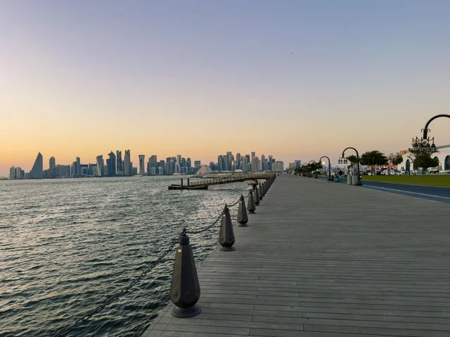 Doha Corniche Boardwalk and West Bay Skyline at Sunset