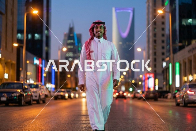 Saudi Man Walking on Riyadh Street with Kingdom Centre
