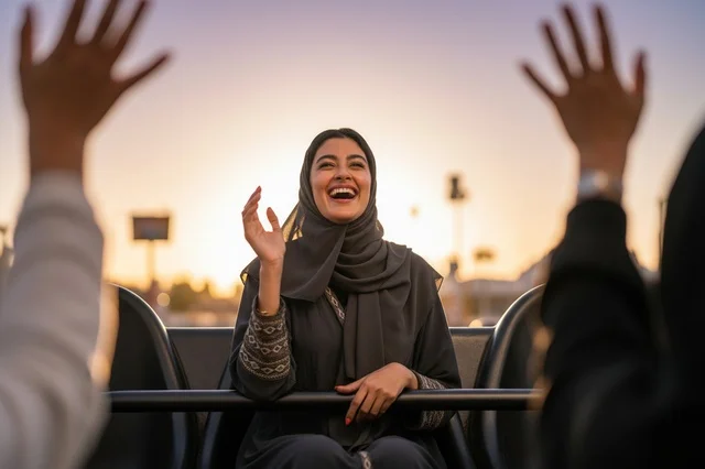 Happy Saudi Woman on Theme Park Ride at Sunset