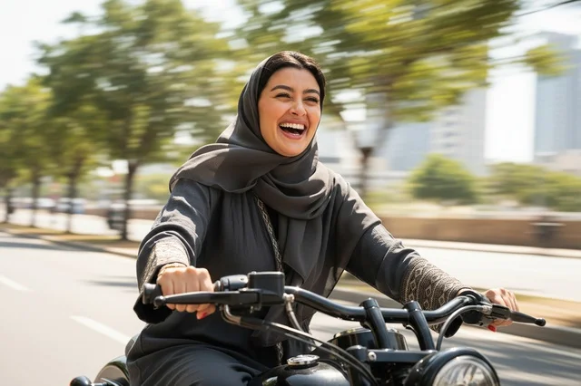 Happy Arab Woman in Abaya Riding Motorcycle on City Street