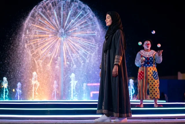 Saudi Woman at Night Festival with Juggling Clown
