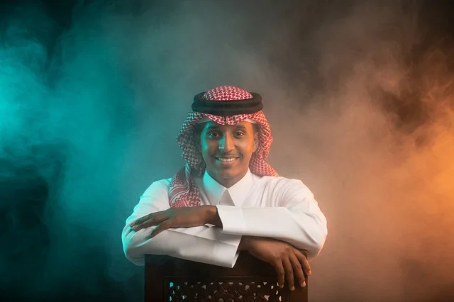 Saudi Man in Traditional Thobe with Smoky Studio Background