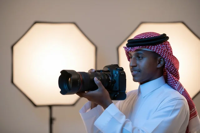 Saudi Photographer with Professional Camera in Studio