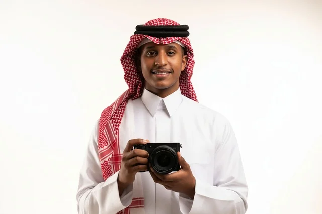 Saudi Photographer in Traditional Thobe Holding Camera