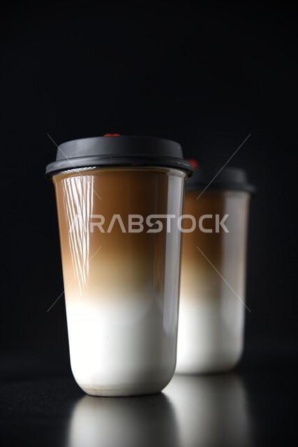 Close-up of plastic cup of delicious hot coffee photographer on black background, delicious hot drinks, cappuccino drink, hot chocolate coffee