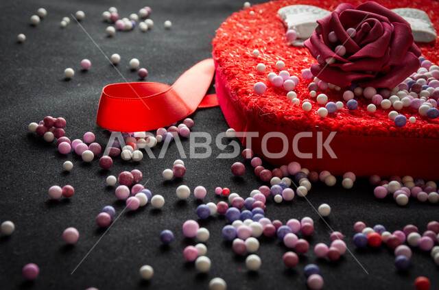 Close-up picture for a large red heart shaped with a red bar on black background, Christmas gift, day love, gift accessories, holidays and events, Valentine, happy occasions