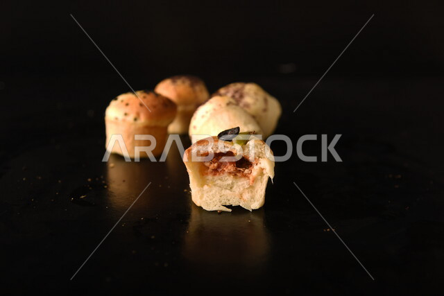 Variety of Delicious Hot Bakery, Fresh Popular Bakery, Bakery and Pastry, Stuffed Hollow Cake Discs, Delicious Food, Black Background