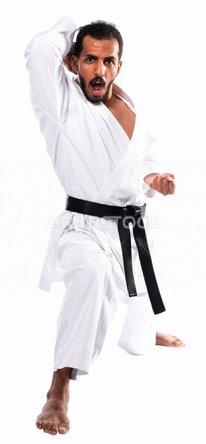 Portrait of a Saudi Arabian Gulf man practicing Japanese karate, white karate uniform with black belt, training in special combat movements, Japanese martial arts, martial arts, physical strength, application of kata movements, white background, full-leng