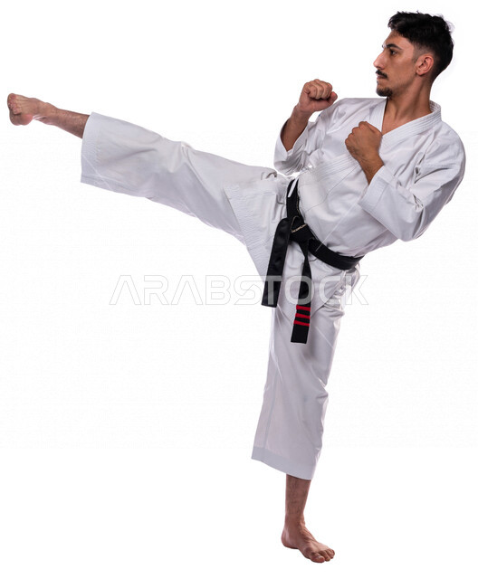 Portrait of a Saudi Arabian Gulf man practicing Japanese karate, white karate uniform with black belt, training in special combat movements, Japanese martial arts, martial arts, physical strength, application of kata movements, white background, full-leng