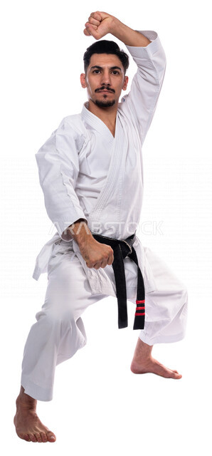 Portrait of a Saudi Arabian Gulf man practicing Japanese karate, white karate uniform with black belt, training in special combat movements, Japanese martial arts, martial arts, physical strength, application of kata movements, white background, full-leng