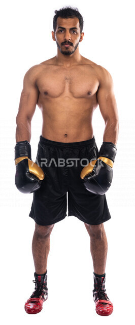 Portrait of a Saudi Arabian Gulf man wearing boxing gloves, practicing self-defense, training in combat movements, boxing and wrestling, health and fitness, Saudi boxing team, full-length picture, full body