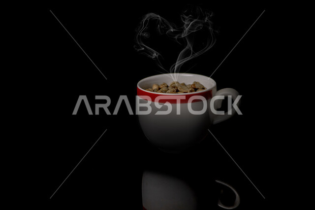 Close-up of a cup of roasted coffee beans, coffee beans, preparing and preparing fresh coffee, making hot drinks from coffee beans