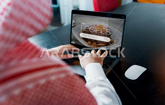A Saudi Arabian Gulf man using a laptop, banner inserting search content, online search mechanism, research, remote work, modern technologies, administrative work