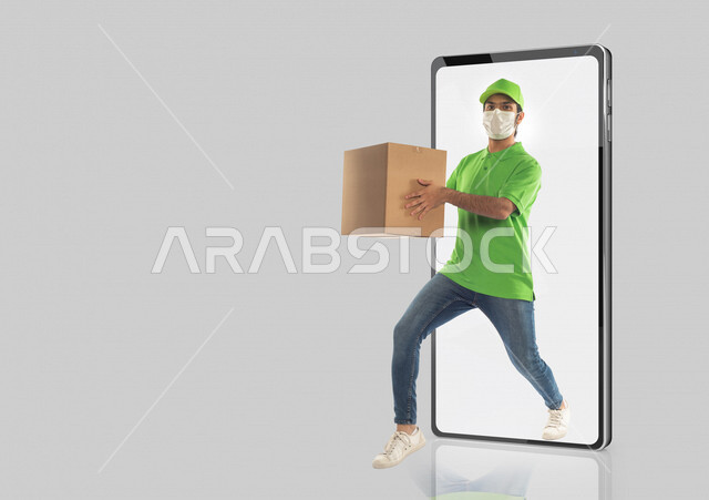 A Saudi Arabian Gulf man on the back of a mobile dressed as a delivery officer, following prevention and safety procedures by wearing a mask, working in delivering orders and goods to customers, online shopping, smart shopping, delivery representative, co