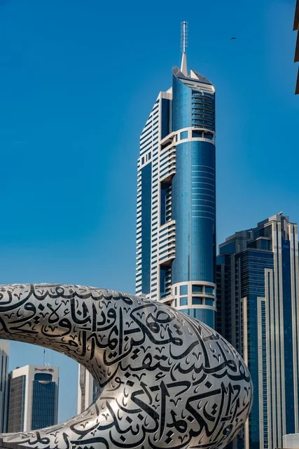 Museum of the Future and Dubai Skyscrapers under Blue Sky