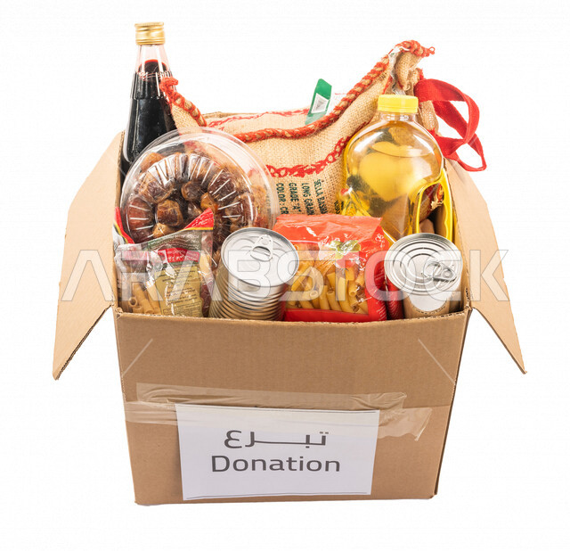 A parcel containing basic food ingredients, donation to the food basket project, food baskets and parcels, charitable works, donations and giving, charities for the needy, humanitarian initiatives, the month of Ramadan