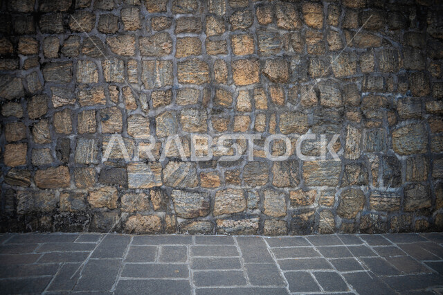صورة خلفية لجدار حجري قديم بارز الشكل ، نسيج الجدار