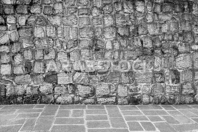 صورة خلفية لجدار حجري قديم بارز الشكل ، نسيج الجدار