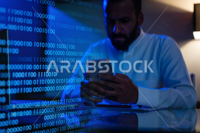 رجل عربي سعودي خليجي يعمل في وظيفة مطور ويب بإستخدام الهاتف المحمول ، استخدام لغات البرمجة، تطوير وبناء المواقع والتطبيقات الالكترونية، اكواد وخوارزميات, هاكر, قرصنه, حماية معلومات, أمن معلومات, ماتريكس