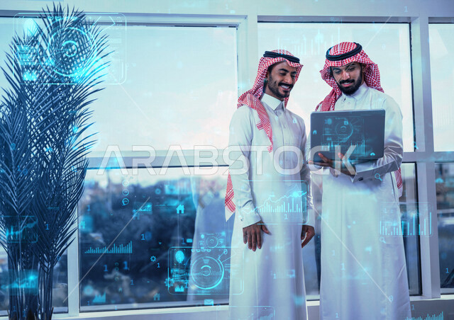 موظفان عربيان خليجيان سعوديان يستخدمان الحاسوب المحمول لمتابعة وإنجاز المهام ، التحليلات والإحصائيات البيانية، قسم التحليلات الرقمية، التوزيع الرقمي والمبيعات، وظائف ومهن، الرسوم البيانية والتوضيحية، دراسة المشاريع