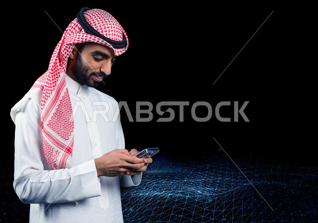 A Saudi Arabian Gulf man, using a mobile phone, e-shopping, using modern technology devices, remote business management, working remotely, using 3D hologram technology
