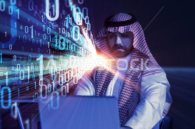 رجل عربي خليجي سعودي، يقوم بإستخدام جهاز الكمبيوتر المحمول، مجموعة من الأرقام والرموز البرمجية بتقنية الهولوجرام ثلاثية الأبعاد ، يعمل في وظيفة مطور ويب، لغة البرمجة والتطوير التكنولوجي، أكواد وخوارزميات، تطوير المواقع والتطبيقات الإلكترونية