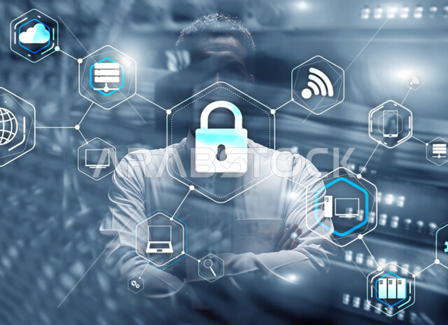 رجل عربي خليجي سعودي يقف متكتف اليدين، أيقونة قفل الأمان مضيئة داخل شبكة عنكبوتية محاطة بمجموعة أيقونات خاصة بالانترنت بتقنية الهولوجرام ثلاثية الأبعاد، الحفاظ على البيانات الشخصية والدخول الآمن، الحماية والأمان