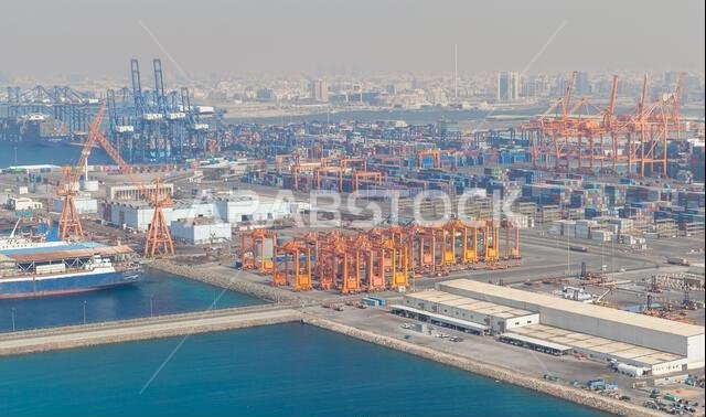 Jeddah, Saudi Arabia - December 22, 2019: Portal cranes of Jeddah Islamic Seaport, aerial view of an industrial harbour
