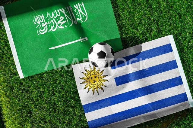 Saudi Arabia vs Uruguay, national flags before world championship Group H group stage match, football on green pitch with goal in the background, Miam