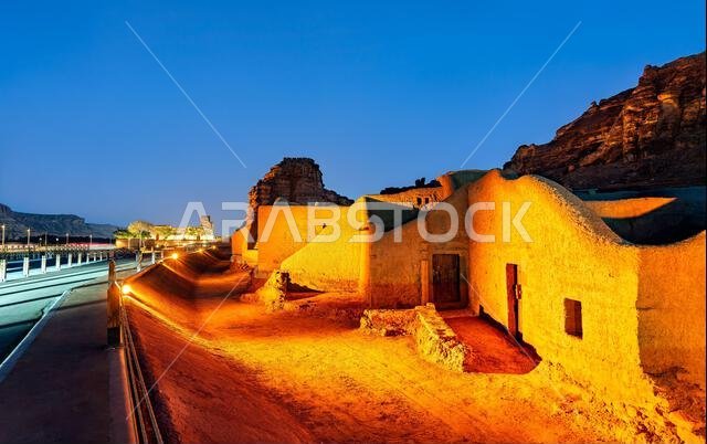 Night view of the illuminated traditional mud-brick houses in the AlUla Old Town, a historic site in the Al Madinah Province of Saudi Arabia.