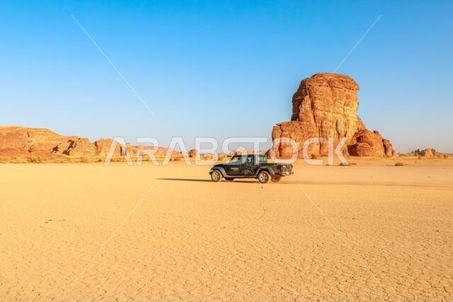 AlUla, Saudi Arabia,Jan 5, 2025: off road vehicle 4x4, driving in desert landscape of AlUla Sharaan Nature Reserve in Saudi Arabia, featuring