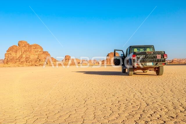 AlUla, Saudi Arabia,Jan 5, 2025: Off road 4x4 suv on dirt road through towering sandstone formations in AlUla Sharaan Nature Reserve in Saudi Arabia