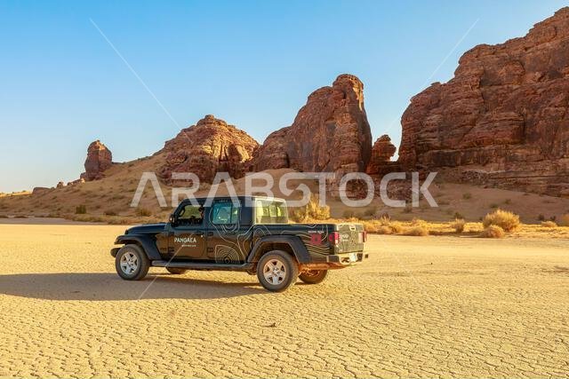 AlUla, Saudi Arabia,Jan 5, 2025: 4x4 car driving on cracked desert of AlUla Sharaan Nature Reserve in Saudi Arabia, creating an adventurous scene