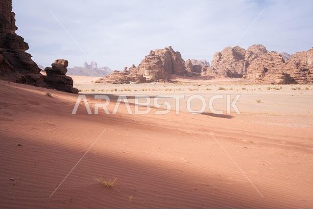 Mountainous desert landscape with sand dunes and big towering rock formations, Tabuk, Saudi Arabia