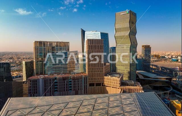 Daytime view of King Abdullah Financial District in Riyadh, Saudi Arabia, featuring modern skyscrapers and contemporary urban architecture. Daytime view of King Abdullah Financial District in Riyadh, Saudi Arabia, featuring modern skyscrapers and contemporary urban architecture.