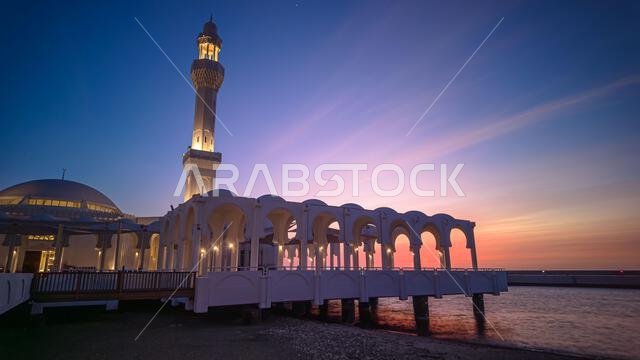 sunset in Jeddah Waterfront with Al-Rahmah mosque and JYC Jeddah Yacht Club building in the foreground, Saudi Arabia