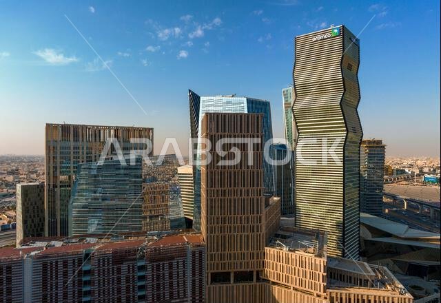 Daytime view of King Abdullah Financial District in Riyadh, Saudi Arabia, featuring modern skyscrapers and contemporary urban architecture. Daytime view of King Abdullah Financial District in Riyadh, Saudi Arabia, featuring modern skyscrapers and contemporary urban architecture.