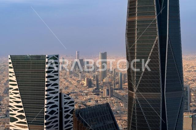 Daytime view of King Abdullah Financial District in Riyadh, Saudi Arabia, featuring modern skyscrapers and contemporary urban architecture. Daytime view of King Abdullah Financial District in Riyadh, Saudi Arabia, featuring modern skyscrapers and contemporary urban architecture.
