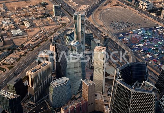 Daytime view of King Abdullah Financial District in Riyadh, Saudi Arabia, featuring modern skyscrapers and contemporary urban architecture. Daytime view of King Abdullah Financial District in Riyadh, Saudi Arabia, featuring modern skyscrapers and contemporary urban architecture.
