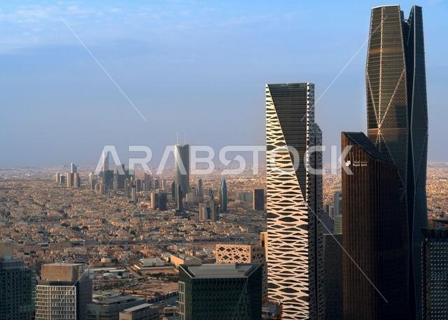 Daytime view of King Abdullah Financial District in Riyadh, Saudi Arabia, featuring modern skyscrapers and contemporary urban architecture. Daytime view of King Abdullah Financial District in Riyadh, Saudi Arabia, featuring modern skyscrapers and contemporary urban architecture.