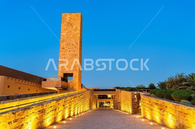 Sheikh Muhammad ibn Abd al-Wahhab Mosque with a beautifully illuminated stone tower and walkway in Diriyah, Riyadh, Saudi Arabia during blue hour Sheikh Muhammad ibn Abd al-Wahhab Mosque with a beautifully illuminated stone tower and walkway in Diriyah, Riyadh, Saudi Arabia during blue hour
