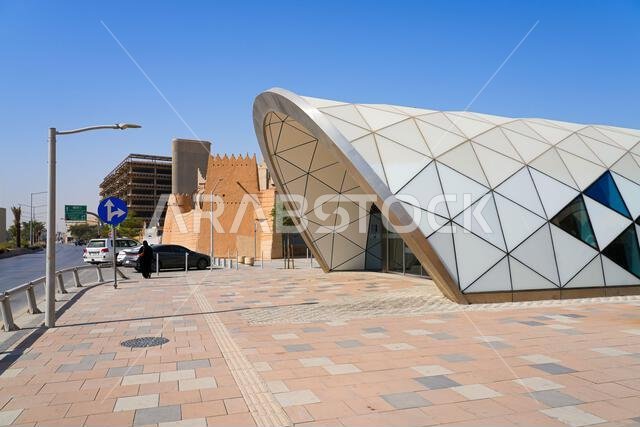 Modern geometric entrance of Court Complex Metro Station next to the traditional mud brick walls of Al Dho historical district, Riyadh, Saudi Arabia