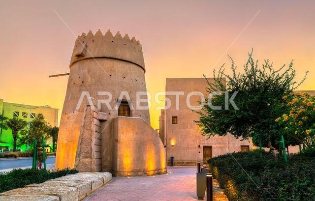 Historic clay watchtower illuminated at sunset in the ad-Dirah neighborhood of Riyadh, Saudi Arabia