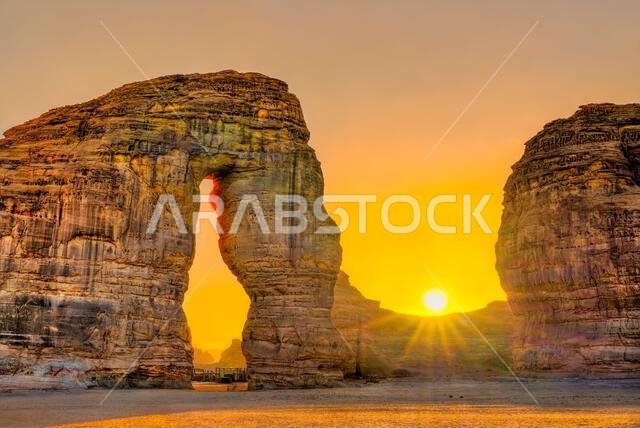 Beautiful sunset over the Elephant Rock sandstone formation in the desert landscape of Al Ula Saudi Arabia.