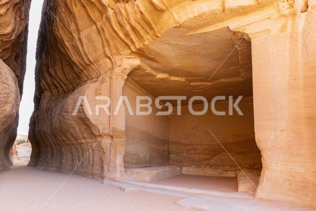 The Diwan, a rock-cut chamber, and Siq Canal part of Jabal Ithlib at the ancient Nabataean archaeological site of Hegra (AlUla), Saudi Arabia