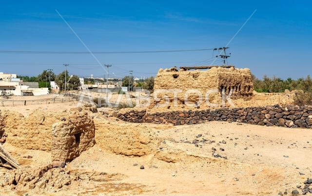 Detailed view of the historic mudbrick ruins of Shanqal Fort located in the desert landscape of Turbah within the Makkah Province of Saudi Arabia.