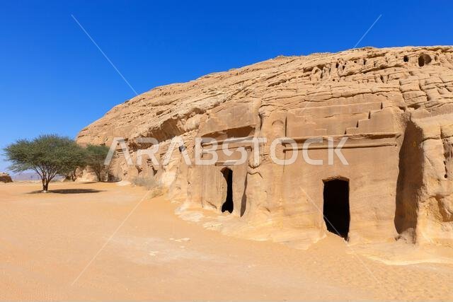 Rock-cut tombs at Jabal al-Banat (Mountain of the Women) at the Nabataean archaeological site of Hegra near Ul Ula, Saudi Arabia Rock-cut tombs at Jabal al-Banat (Mountain of the Women) at the Nabataean archaeological site of Hegra near Ul Ula, Saudi Arabia