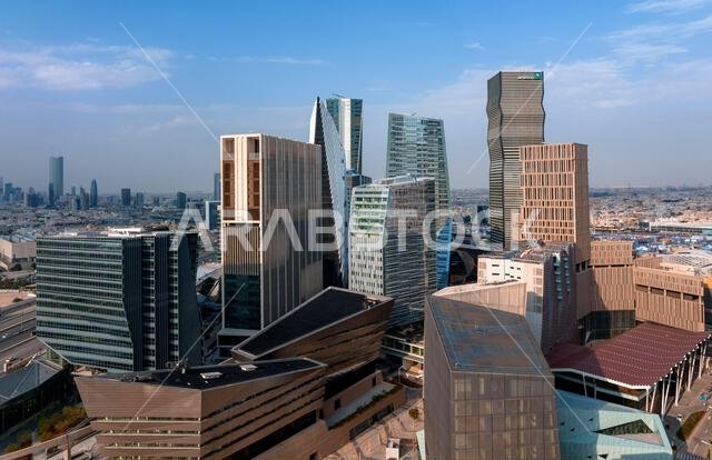 Daytime view of King Abdullah Financial District in Riyadh, Saudi Arabia, featuring modern skyscrapers and contemporary urban architecture. Daytime view of King Abdullah Financial District in Riyadh, Saudi Arabia, featuring modern skyscrapers and contemporary urban architecture.